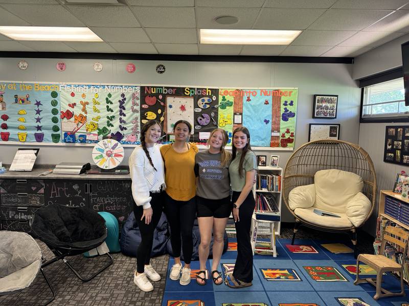 (From left) Paige Walker, Tanna Curry, Abby Hougas and Kira Dergo, four of the seven students who are among the first to receive dual credit for a four-year university from the Grundy Area Vocational Center.
