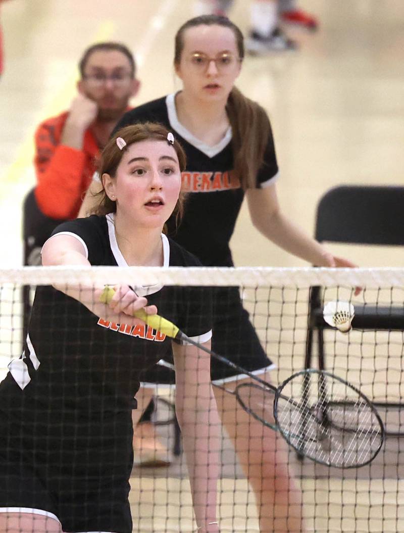 DeKalb’s Kaitlyn Davis hits a backhand as her partner Lea Guelde looks on Friday, May 12, 2023, during their doubles match against Joliet Central at the IHSA State Badminton Finals at DeKalb High School.