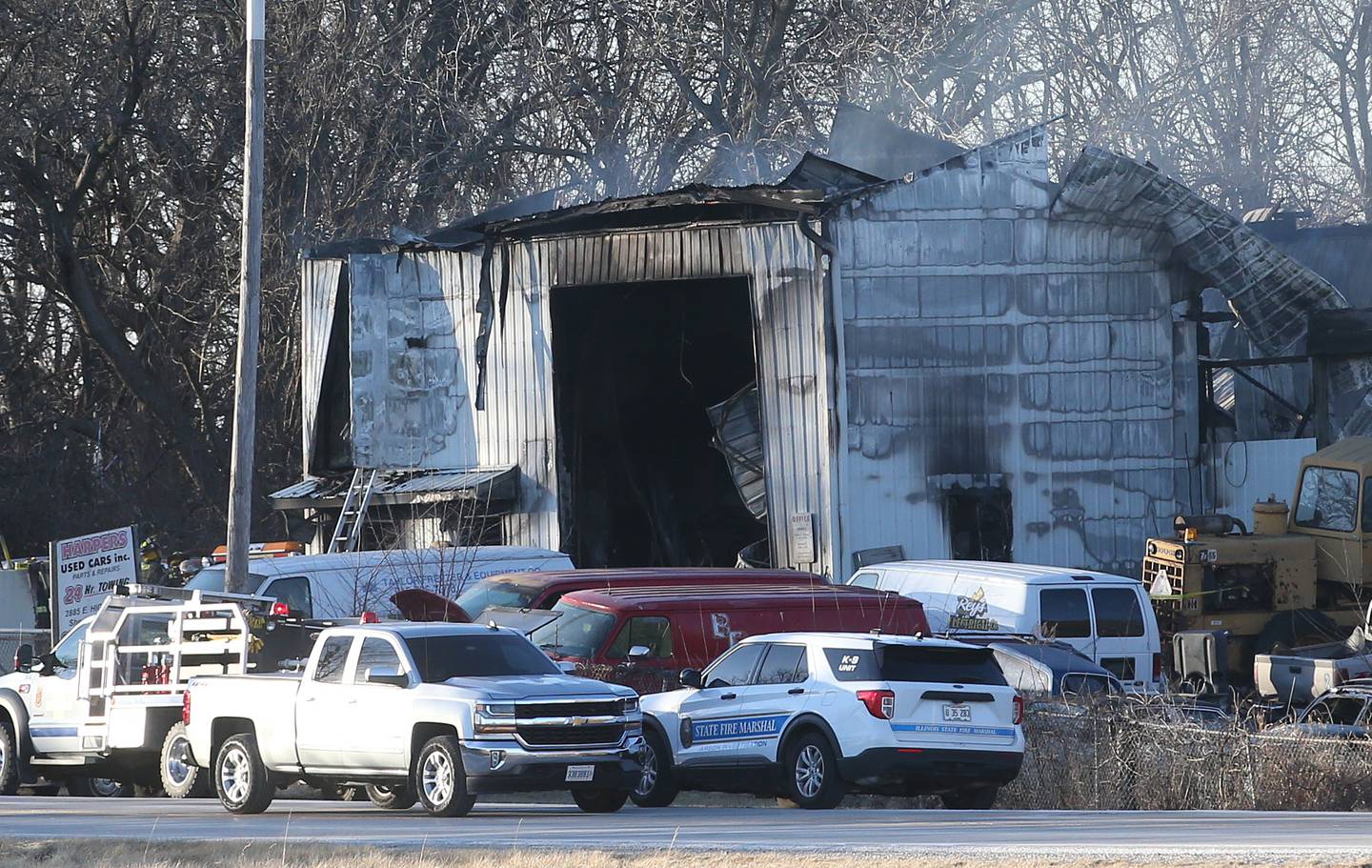 Smoke smolders from the roof of Harpers Used Cars and Towing on Tuesday, Jan. 25, 2025 in Sheridan.