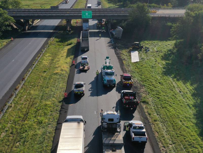 An aerial view showing emergency crews working the scene of a semi truck that struck the overpass of Illinois Route 251 and Interstate I-80 on Friday, Sept. 26, 2025 in Peru. The driver of the semi had to be extricated. Illinois State Police, Peru Fire and EMS, Senica Towing and Illinois Department of Transportation were all on the scene. The incident happened in a construction zone on Interstate I-80 shortly after 7:15a.m.