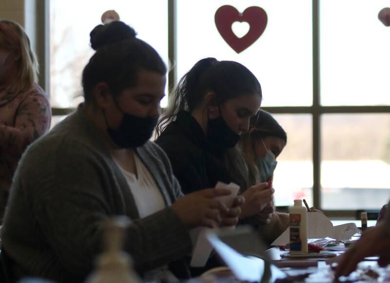 Genoa-Kingston students in conjunction with the Genoa-Kingston High School Impact Club make Valentines Day cards Tuesday, Jan. 25, 2022, in the library at the school. The cards they are making will be part of “Valentines for Seniors,” a card drive for local seniors living in residential care facilities, sponsored by State Representative Jeff Keicher, R-Sycamore, and State Senator Dave Syverson R-Rockford.