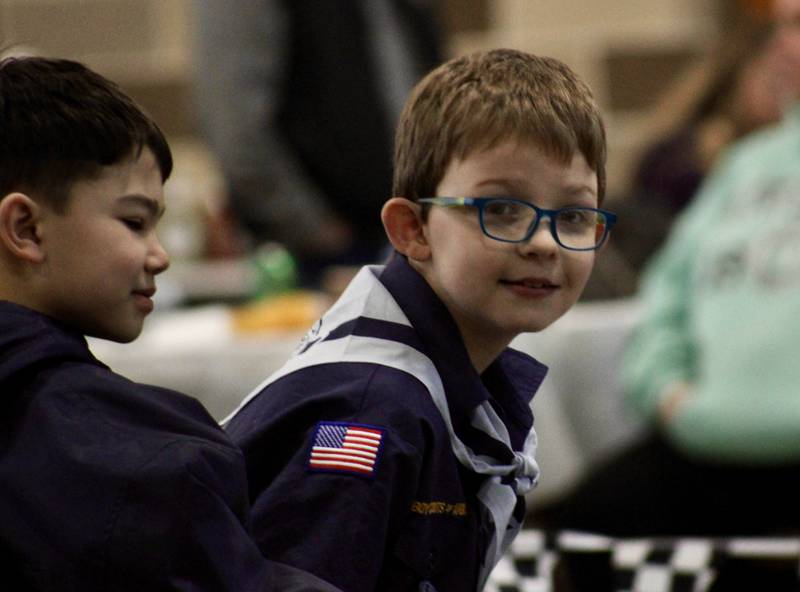 A Cub Scout of Bear rank looks expectantly down the track for the start of the next race during the Cub Scout Pack 85 Pinewood Derby held Saturday, Feb. 11, 2023, at Bethel Evangelical Congregational Church in Dixon.