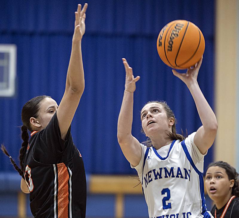 Newman’s Helen Papoccia puts up a shot against Kewanee’s Damaris Diaz Thursday, Feb. 6, 2025, at Newman High School.