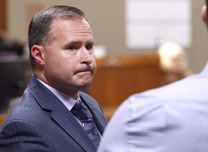 William Bishop looks back at the people in the gallery during a break in his bench trial before McHenry County Judge Michael Coppedge on Monday, Oct. 17, 2022, in the McHenry County courthouse in Woodstock.