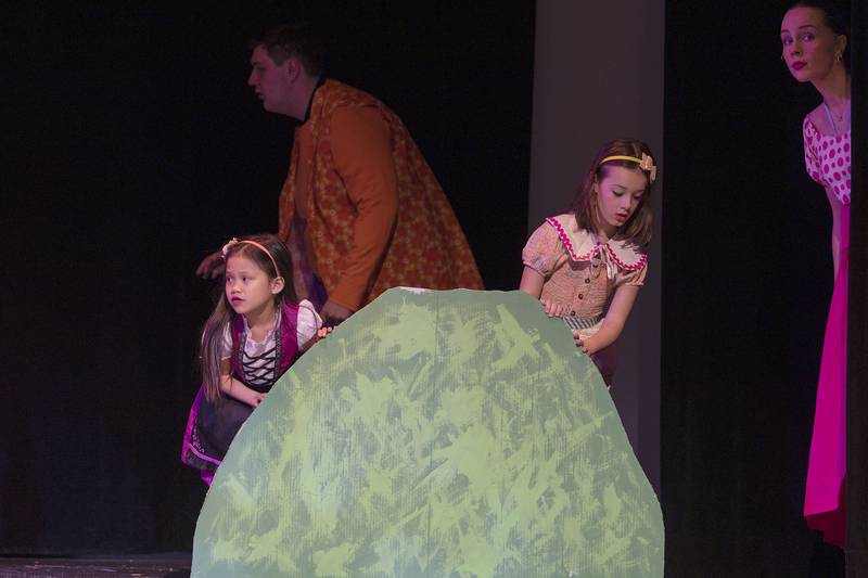 The Munchkins come out of hiding during rehearsal Wednesday, April 9, 2025, for Newman High School’s rendition of “The Wizard of Oz.”
