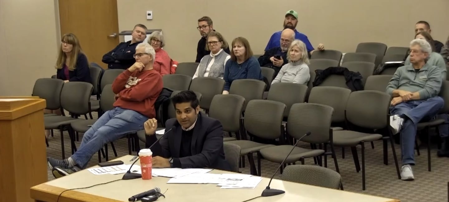 Business owner Sumish Parikh speaks at a Crystal Lake City Council meeting on Dec. 2, 2025 to propose building a Dunkin' Donuts drive-thru location at 154 S. Virginia St.
