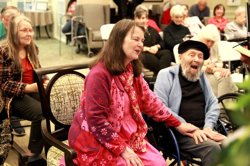 Marcia Whitney-Schenck and Robert Schenck, who have been married for 42 years, share a laugh while renewing their wedding vows on Friday, Feb. 14, 2025 at Churchill Place, an Anthem Memory Care community in Glen Ellyn.