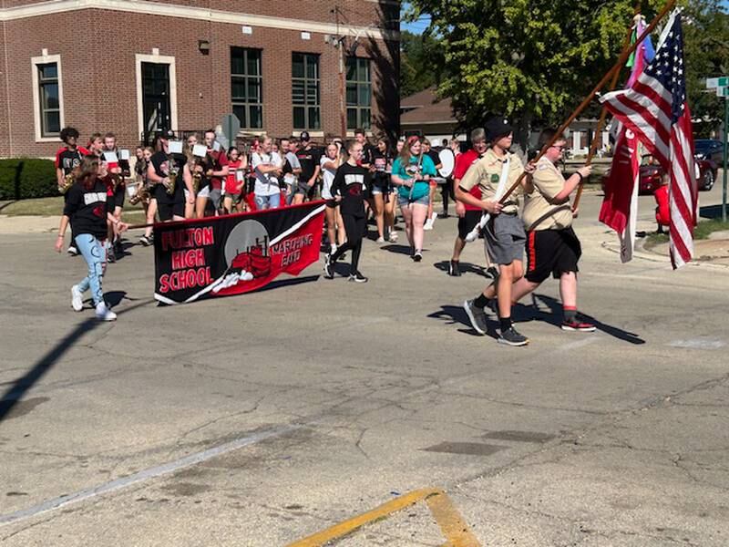 The Fulton High School band rounds the corner at 10th Avenue and Fourth Street on Friday, Sept. 20, 2024, during the annual Homecoming parade.