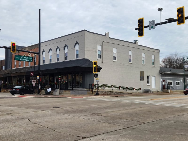 The owner of a brick building in downtown Oswego this month was given permission to finish painting the rest of the building’s exterior even though the village’s ordinance prohibits it.
Village trustees unanimously approved the variance for the building, located at 76-78 Main Street. Premier Investments LLC. requested the variance.