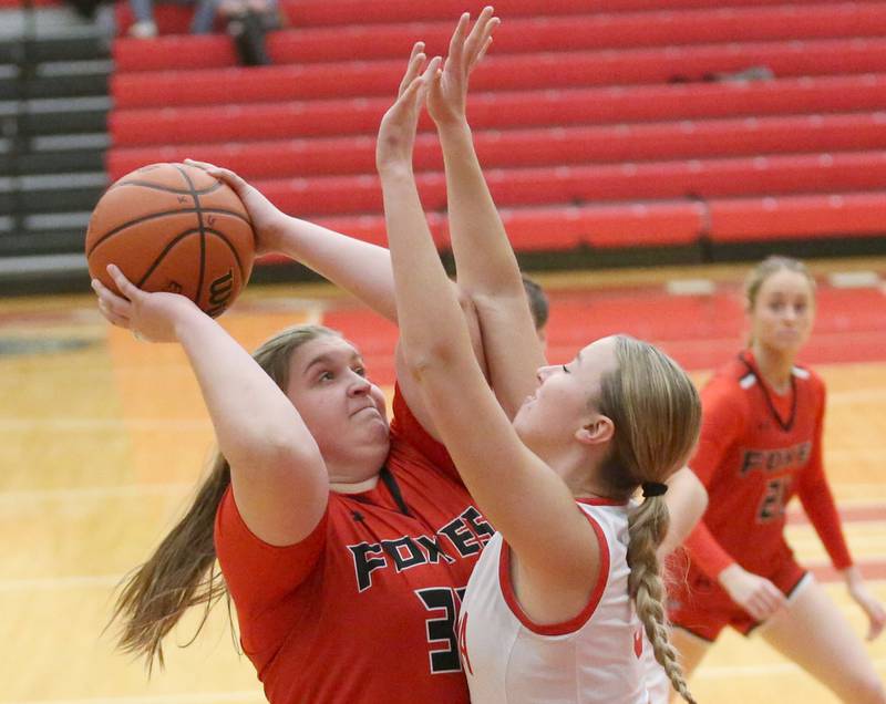 Yorkville's Madi Spychalski looks to get around Ottawa's Skylar Dorsey on Monday, Dec. 4, 2023 at Kingman Gym.