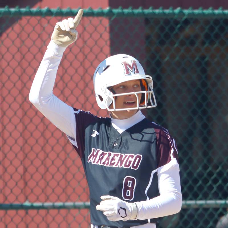 Marengo’s Gabrielle Gieseke celebrates scoring as she was along for the ride on an AJ Pollnow grand slam against North Boone in varsity softball at Marengo High School in Marengo on Saturday, March 22, 2025.