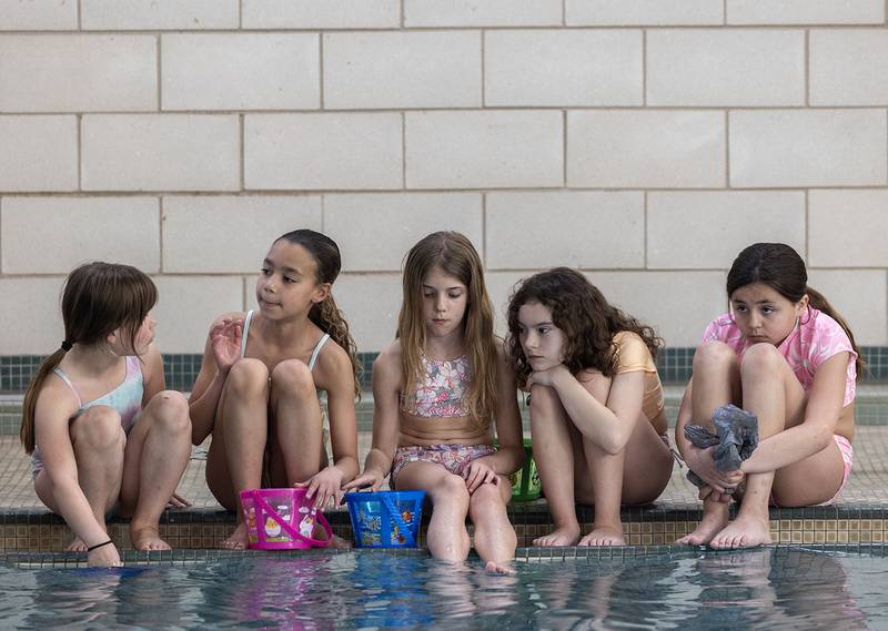 Baylor Parvin (center) sits with her squad Friday, April 11, 2025, poolside at the Sterling-Rock Falls YMCA. Parvin is celebrating her ninth birthday with the Easter Egg Hunt at the pool and a sleepover with her friends.