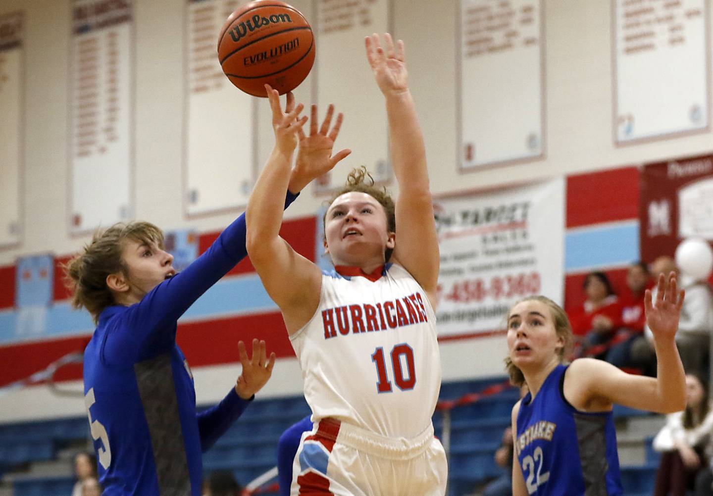 Marian Central's Jordyn Kratochvil drives to the basket between Westlake Christian’s Juliette Sigurnjak and Megan Anderson during a non-conference girls basketball game Monday, Feb. 6, 2023, at Marian Central High School  in Woodstock.