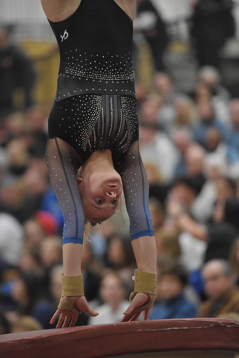 Geneva's Brooke Lussnig on the vault at the Hinsdale South girls gymnastics sectional meet in Darien on Tuesday, February 7, 2023.