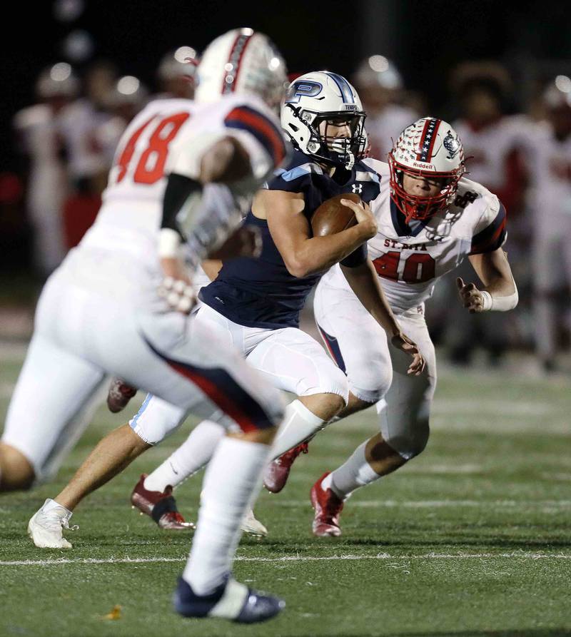Prospect's Brad Vierneisel (13) moves the ball upfield against St. Rita during the second round of the IHSA Class 7A Playoffs Friday November 4, 2022 in Mount Prospect.