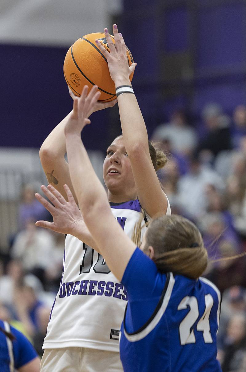 Dixon’s Addy Lohse puts up a shot against Geneva Thursday, Feb. 19, 2026, in the Class 3A girls basketball regional title game.