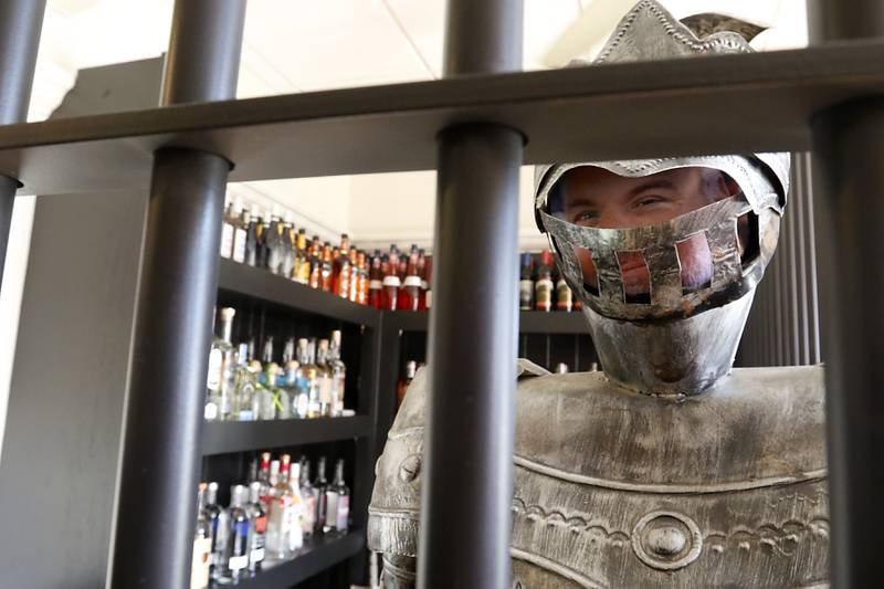 A knight, with a picture of Bob Karas, guards the liquor storage area Tuesday, Nov. 12, 2024, at Squire on the Square in Woodstock. 

The restaurant, which has similar decor as other Village Squire restaurants, is a joint venture between the Linardos family and Bob Karas of Karas Restaurant Group.

Squire on the Square is located in the basement of the Old Courthouse in Woodstock, and its menu will feature items similar to the Linardos family’s restaurants and the Village Squire.  

The eatery replaces the Public House that closed at the end of March.