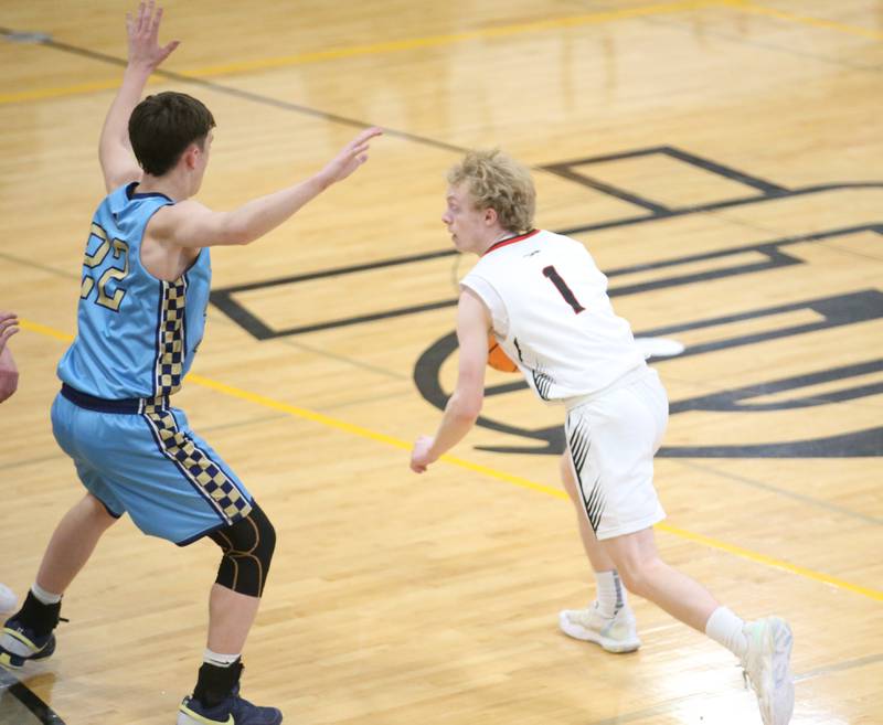 Woodland's Connor Dodge runs the ball around Marquette's Griffin Dobberstein during the Tri-County Conference Tournament on Tuesday, Jan. 28. 2025 at Putnam County High School.