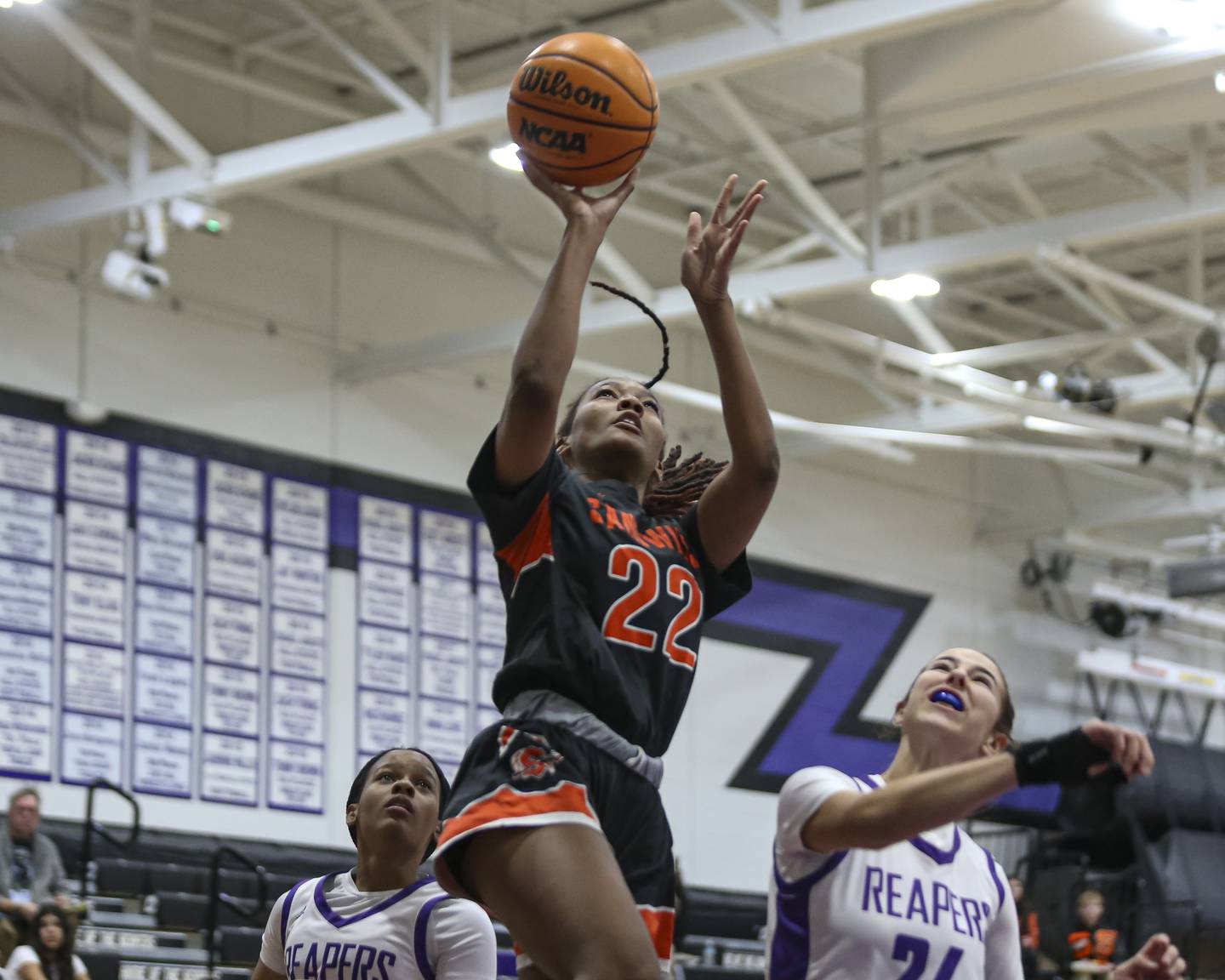 Sandwich's Alayla Harris (22) puts in a layup during their basketball game between Sandwich at Plano Tuesday, Dec 2, 2025 in Plano.