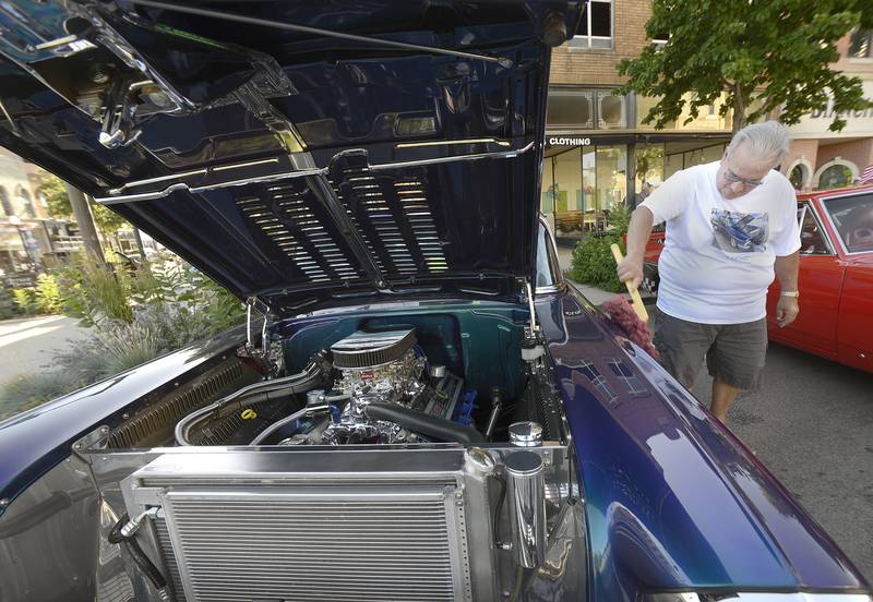 ack Capitani shines up his 57 Chevy during the annual Ottawa Cruise Night sponsored by The LaSalle County Cruisers.