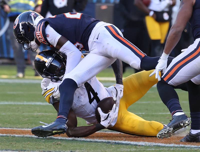 Chicago Bears cornerback Nahshon Wright puts a big hit on Pittsburgh Steelers wide receiver DK Metcalf Sunday, Nov. 23, 2025, during their game at Soldier Field in Chicago.