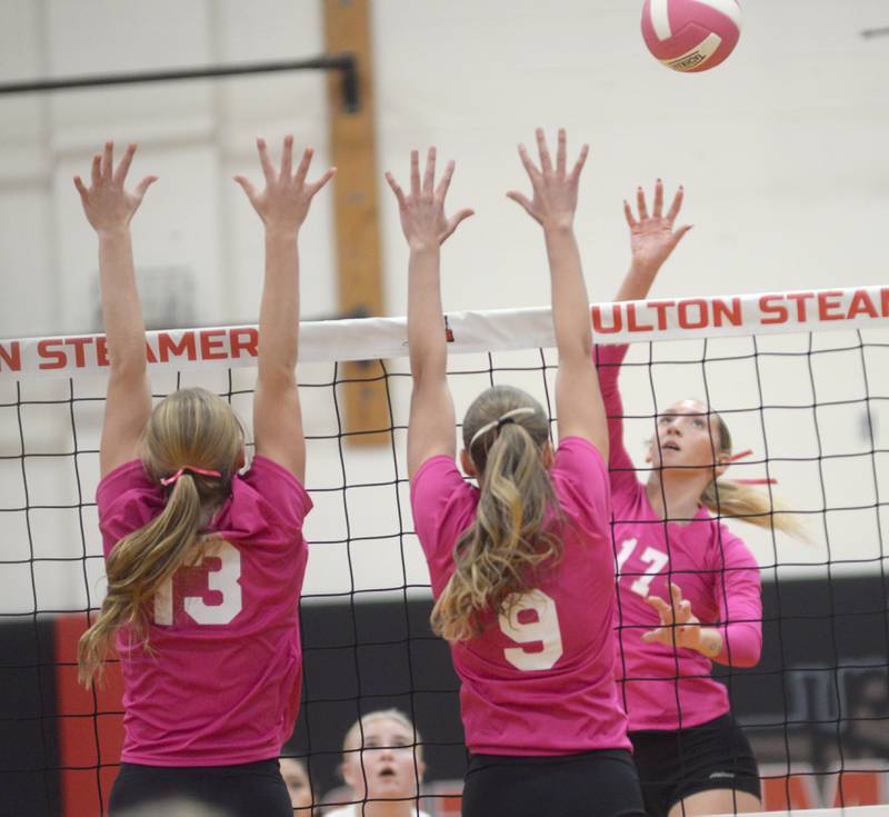 Eastland's Trixie Carroll (17) tries to direct the ball past Fulton blockers Haley Smither (13) and Jessa Read (9) on Tuesday, Oct. 7, 2025 in Fulton.