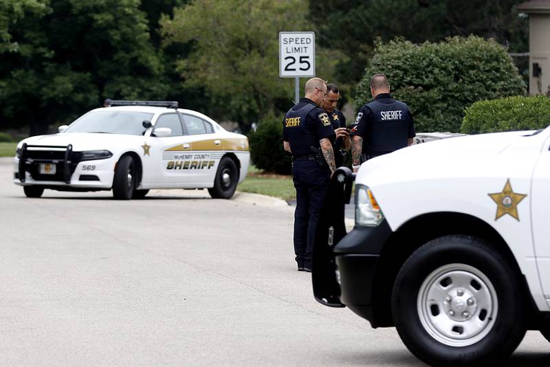 Officers from the McHenry County Sheriff and other departments investigate a domestic incident in which four people were killed on Wednesday Aug. 9, 2023, in the 5800 block of Wild Plum Road in unincorporated Crystal Lake. Police later said they were family members.