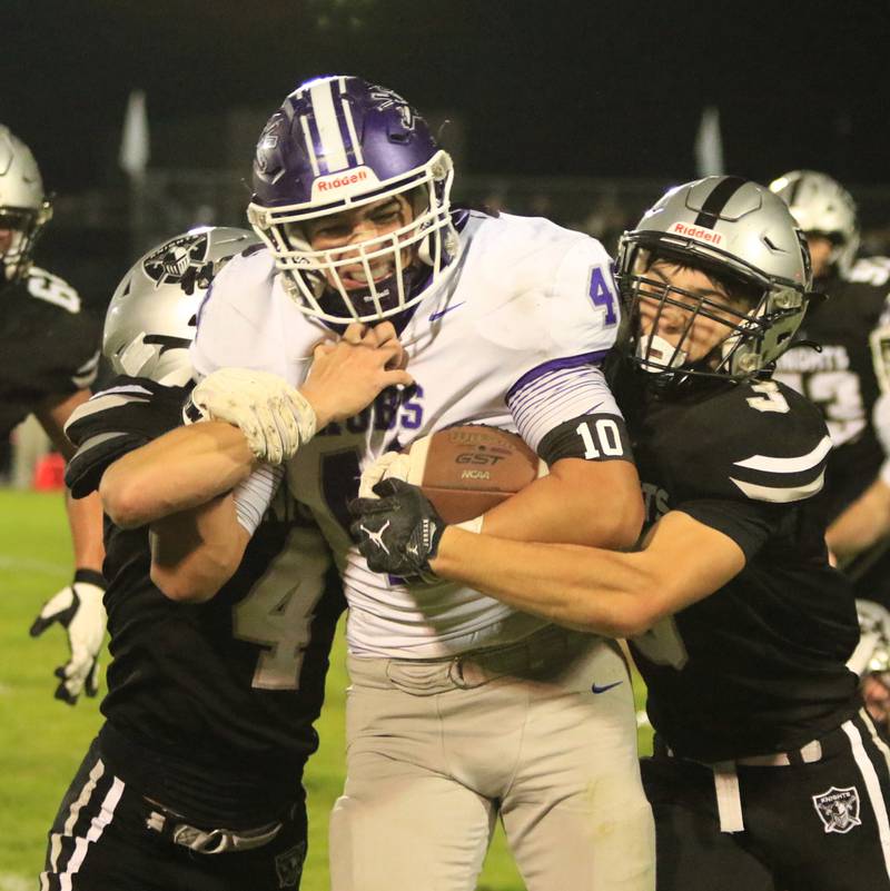 Rochelle running back Romman Villalobos attemps to break a Kaneland tackle during their game on Friday, Oct. 10, 2025.