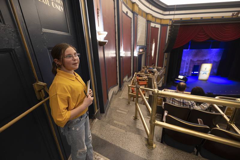 Isabella Sarno, 10, helps people find their seats and sells tickets to help the children’s theater group Sunday, March 2, 2025, at The Dixon.