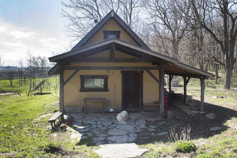 Jones built this small cabin on the property when he was 19. The walls are made of clay and straw for insulation and fire resistance.