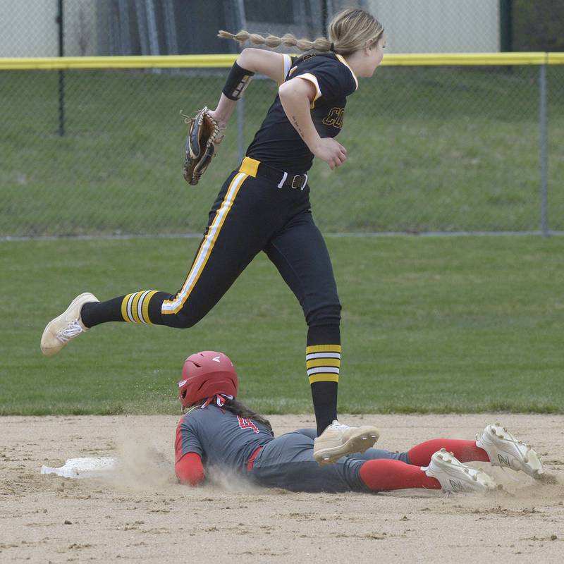Reed Custer’s Madison Keenan leaps over Ottawa’s Annamaria Corsolini as she slides into 2nd base in the 3rd inning Friday at Ottawa.