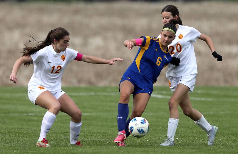 Johnsburg's Liz Smith (center) controls the ball between Richmond-Burton's Nicole Mendlik (left) and Ella Seyller (right) during the Kishwaukee River Conference Girls Soccer Tournament Championship match on Wednesday, May 6, 2026, at Johnsburg High School.