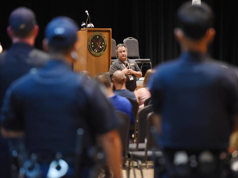 Round Lake Beach Police Chaplain Tim Perry tells the crowd of 100 that first responders "are warriors" at a community gathering of support on Wednesday, June 15, 2022, at the Round Lake Beach Cultural and Civic Center  after Monday’s killing of three young siblings.