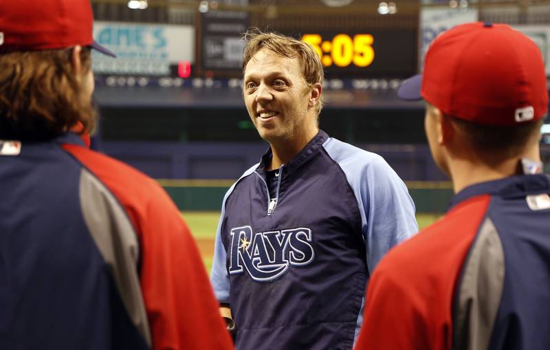 Tampa Bay Rays' Shelley Duncan, center, speaks with former teammates on the Cleveland Indians prior to a baseball game Friday, April 5, 2013, in St. Petersburg, Fla. (AP Photo/Mike Carlson)