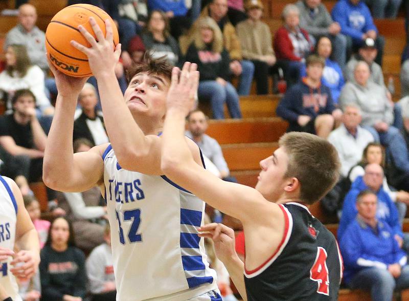 Princeton's Owen Hartman eyes the hop as Hall's Luke Bryant defends on Friday, Feb. 13, 2026 at Princeton High School.