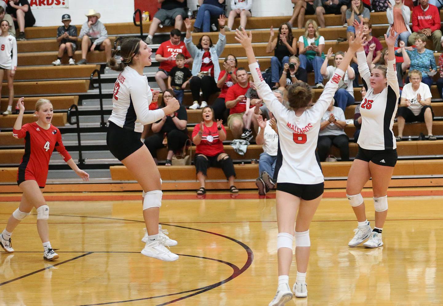 Members of the Henry-Senachwine volleyball team react after defeating Woodland on Thursday, Oct. 3, 2024 at Henry-Senachwine High School.