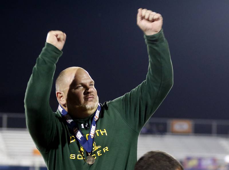 Crystal Lake South Head Coach Brian Allen celebrates defeating Peoria Notre Dame in the IHSA Class 2A state championship soccer match on Saturday, Nov. 4, 2023, at Hoffman Estates High School.