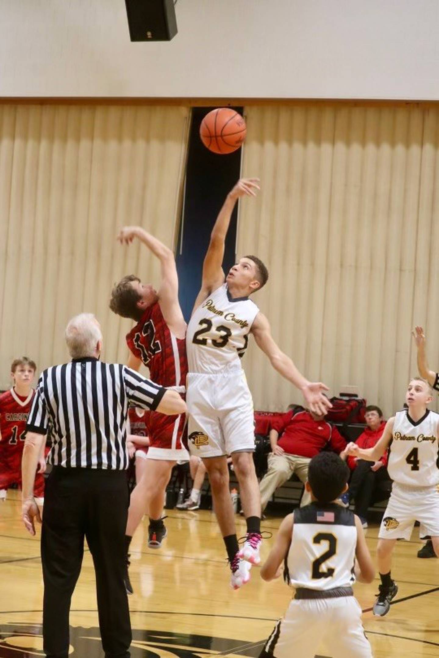 Cohen Pierski takes the center jump for the Pumas on eighth-grade night against Henry. The Pumas won 43-25.