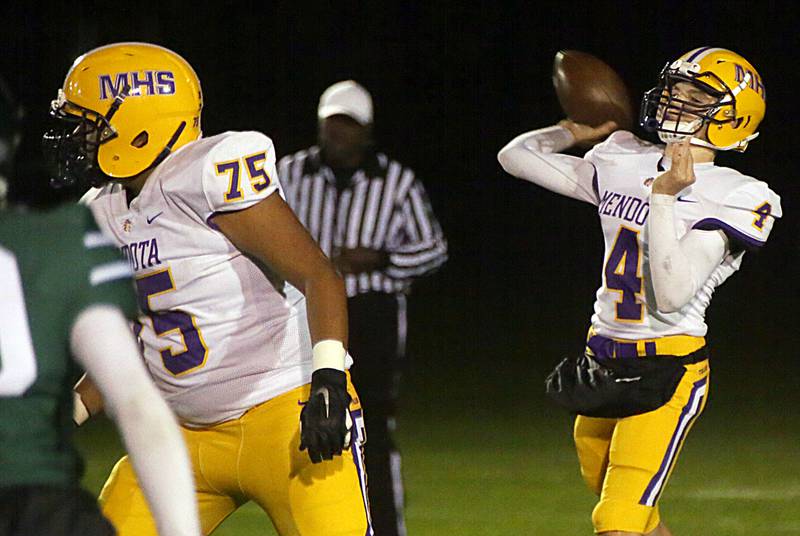 Mendota's quarterback Justin Randolph, (no,4) throws a pass against St. Bede on Thursday Oct. 21, 2021