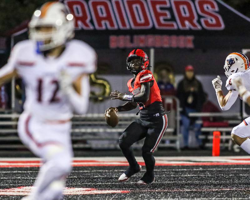 Bolingbrook's Matthew Candler (5) gathers to make a throw down field during a football game between Oswego at Bolingbrook on Friday, Oct 4th, 2024  in Bolingbrook.