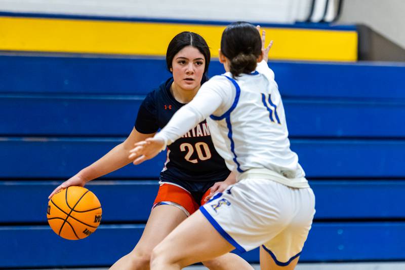 Romeoville's Julissa Olague goes against Joliet Central's Alexis Pedrosa during a varsity girls basketball game at Joliet Central on Dec. 18, 2025.