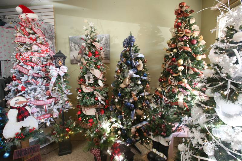 A view of a collection of Christmas trees on Tuesday, Nov. 12, 2024 at Ups ale Resale in Spring Valley. For over 17 years the business has hosted a yearly Christmas Tree and Decor Auction, featuring unique items and themed trees that customers can add to their collections. The items will be on display in the window of the business, located at 214 W. St. Paul St. in Spring Valley. The auction takes place Thursday from 10a.m.-2p.m. Proceeds from the auction will go toward Upscale’s Helping Hands Charity to help out local communities.