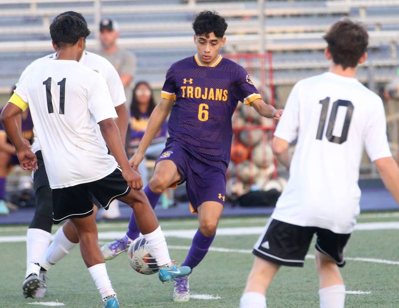 Mendota's Danny Garcia passes the ball around Kewanee defenders Alex Barron and teammate Kingston Peterson during the Three Rivers Tournament on Thursday, Oct. 2, 2025 at Mendota High School.