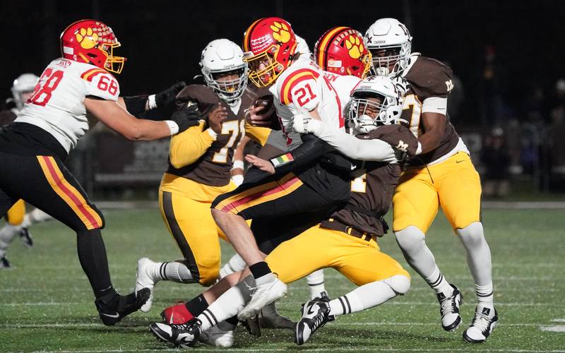 Mt. Carmel's Daniel Banks (44) sacks Batavia’s Ryan Boe (21) for a loss during a class 7A semifinal football playoff game at Mt. Carmel High School in Chicago on Saturday, Nov 18, 2023.