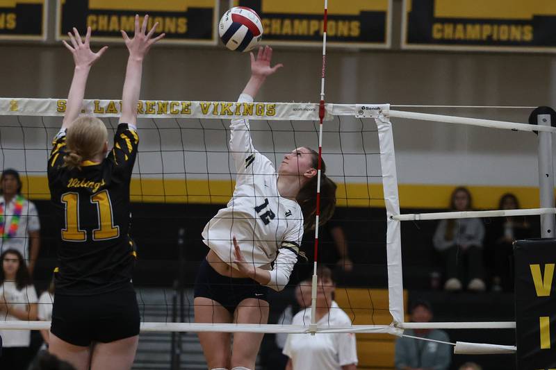 Lemont’s Izabella Kowalczyk goes for the kill against St. Laurence in the Class 3A St. Laurence Sectional championship on Thursday, Nov. 7, 2024 in Burbank.