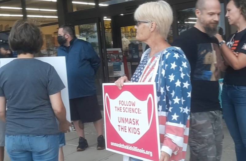 People protesting the statewide mask mandate stand outside of World Market on Saturday, Sept. 4, 2021.