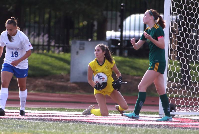 Fremd goal keeper Emily Gordon (center) makes a save during the Class 3A state semifinal game against St. Charles North at North Central College in Naperville on Friday, May 31, 2024.