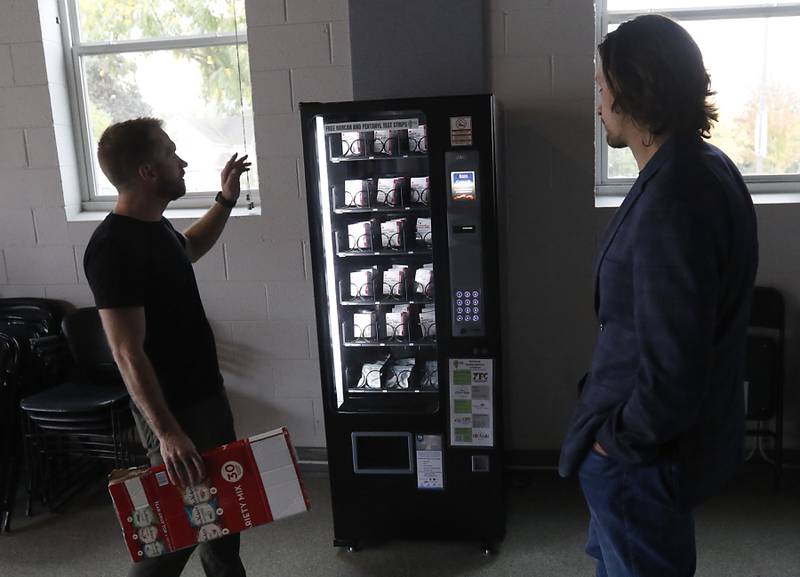 Chris Jacob and Bobby Gattone talks about the Narcan vending machine on Wednesday, Oct. 4, 2023, at the Other Side Cafe & Sober Bar in Crystal Lake. The vending machine is one of several free Narcan vending machines installed around the county by the McHenry County Mental Health Board.