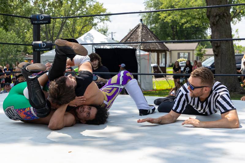 (left to right) Davey Bang of 'Bang and Matthews' is pinned by Gaige Noonan of 'The Hype" excites crowd at the Taste of the Illinois Valley DreamWave Wrestling event on Saturday, August 2, 2025 at Centennial Park in Peru.