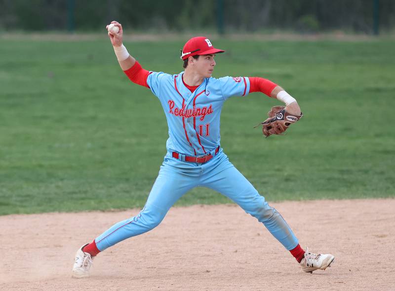 Benet's Luke Bafia (11) throws to first during the varsity baseball game between Benet Academy and Nazareth Academy in La Grange Park on Monday, April 24, 2023.